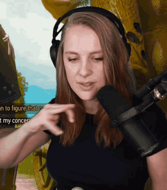 a woman wearing headphones is talking into a microphone with the words " i 'm to figure that out " on the bottom