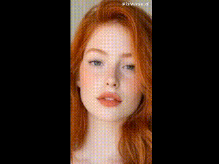 a close up of a woman 's face with a flower in her eyes .