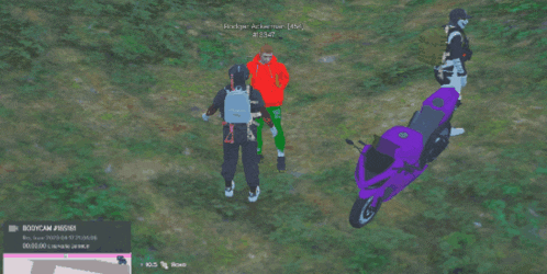a group of people standing next to a purple motorcycle with a screenshot of a video game being played