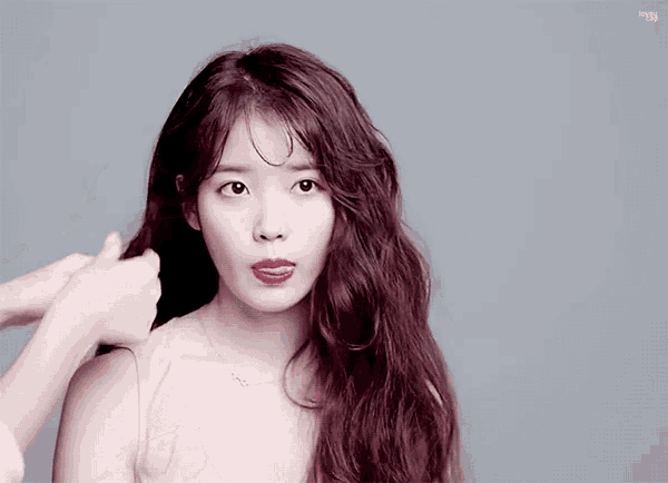 a woman with red lipstick is being touched by another person