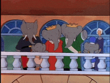 a group of elephants are standing on a balcony wearing crowns