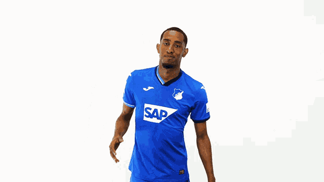 a man wearing a blue shirt with the word sap on the front