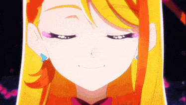 a close up of a girl 's face with a smile on her face