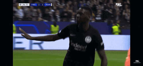 a soccer player wearing a black shirt that says indeed
