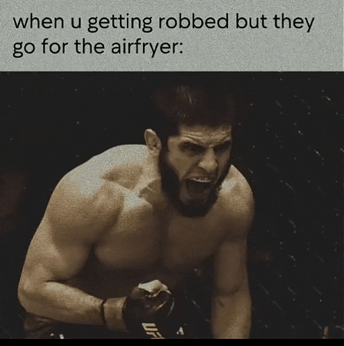 a shirtless fighter with a ufc logo on his glove