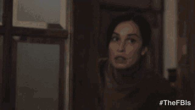a woman says " your gonna wanna see this " while looking out of a window