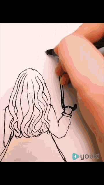 a person is drawing a woman 's back on a piece of paper with the app youkl visible in the corner