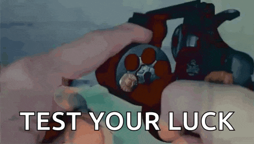 a person is holding a gun with the words test your luck written on it