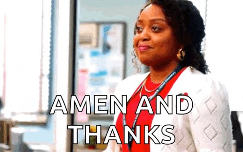 a woman is standing in front of a window with the words amen and thanks above her .