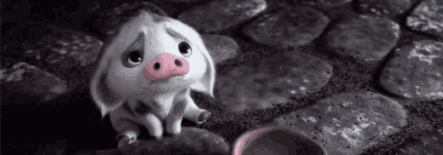 a cartoon pig is sitting on a cobblestone street next to a bowl of food .