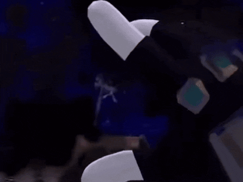 a close up of a person 's hand holding a gun in a dark room .