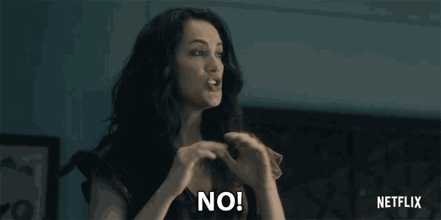 a woman says no in front of a netflix ad