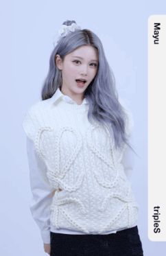 a girl with gray hair is wearing a white sweater vest and a white shirt