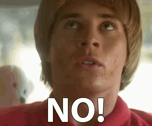 a man in a red shirt says no in white letters