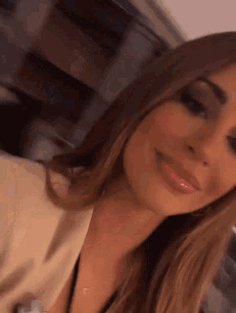 a close up of a woman 's face with a blurred background