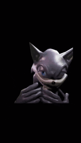 a close up of a cartoon character 's face against a black background