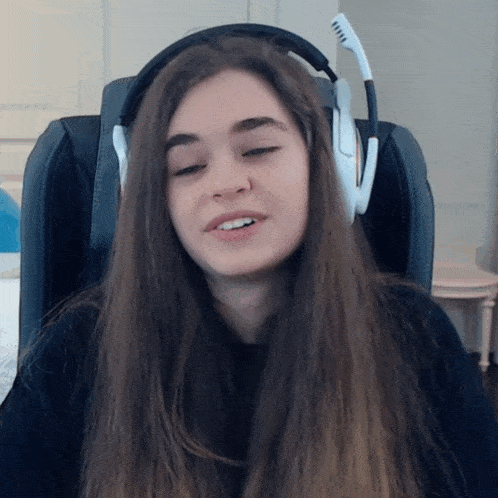 a woman wearing headphones with the letter v on the side