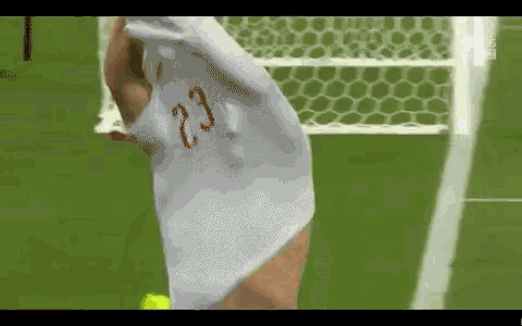 a soccer player with the number 23 on their shirt