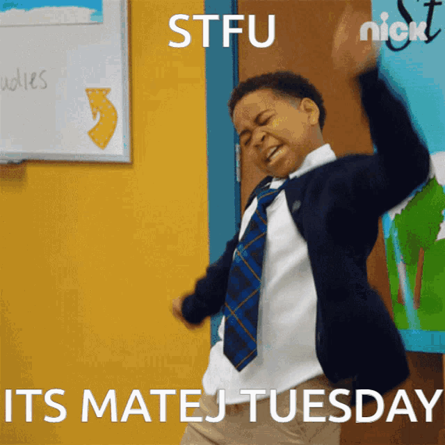 a boy in a school uniform is dancing with the words stfu its matej tuesday