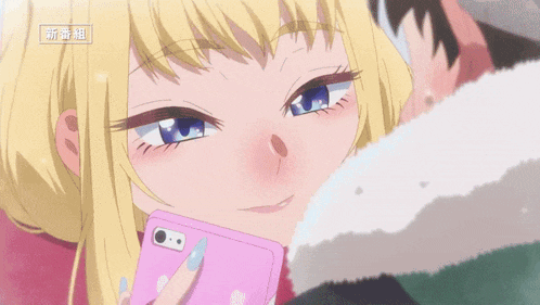 a girl with blonde hair and blue eyes is holding something in her hand