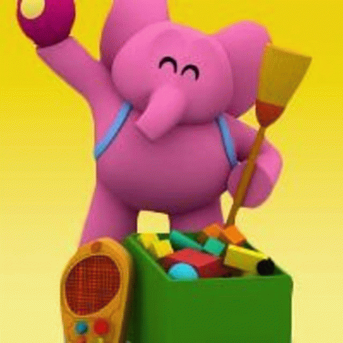 a stuffed elephant is standing next to a box of toys