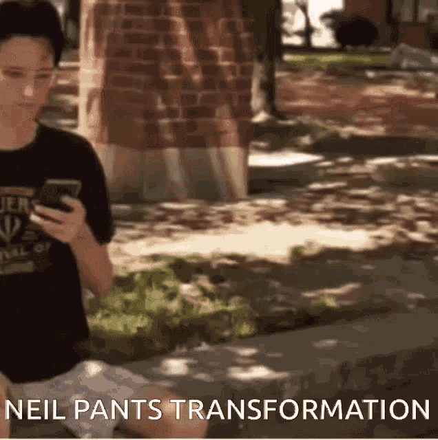 a man sitting on a sidewalk looking at his phone with the words neil pants transformation written below him