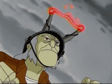 a cartoon character is wearing a helmet with horns and a red lightning bolt above his head .