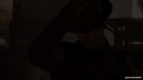 a man wearing a hat and a leather jacket has the hashtag excaliburnefr on the bottom right