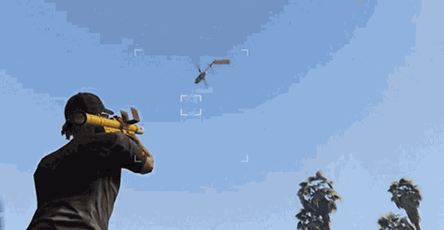 a man in a video game is aiming a rifle at a target that says j.