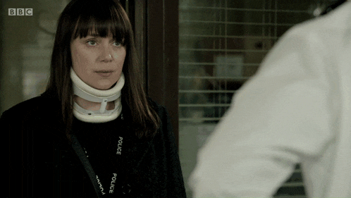 a woman with a neck brace and a bbc lanyard