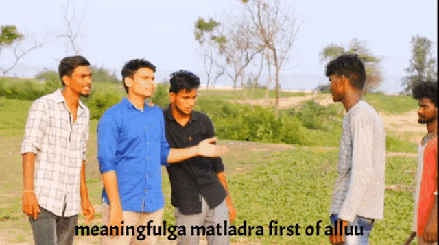 a group of young men standing in a field with the words meaningfulga matladra first of alluu written below them