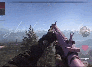 a person is holding a pink gun in their hands in a video game .