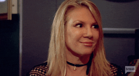 a woman wearing a choker and a bravo logo on her speech bubble