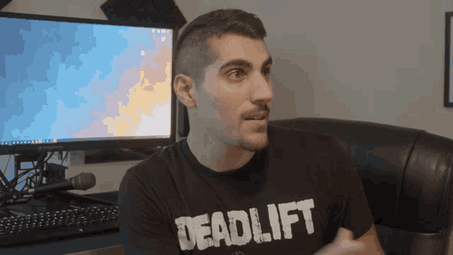 a man wearing a shirt that says deadlift