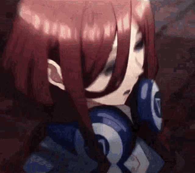 a girl with red hair is wearing headphones and looking at the camera .