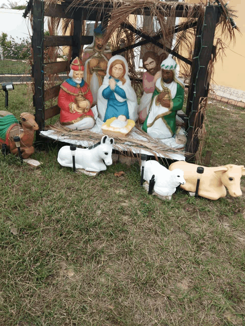 a nativity scene with a baby jesus and the three kings