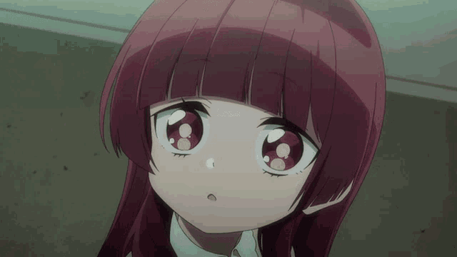 a girl with red hair has a white shirt on