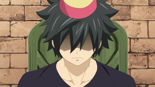 a boy with a birthday hat on his head