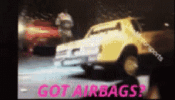 a blurred image of a car with the words got airbags written in pink