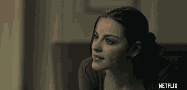 a close up of a woman 's face with netflix written in the corner