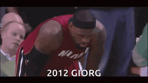 a basketball player with the year 2012 on the bottom of his jersey