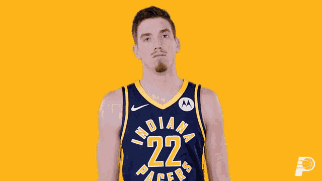 a basketball player for the indiana pacers poses for a picture
