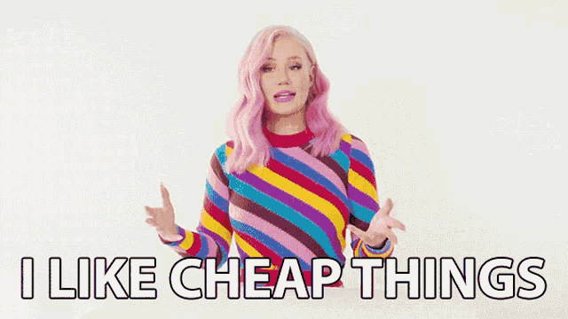a woman with pink hair is wearing a colorful striped sweater and says i like cheap things