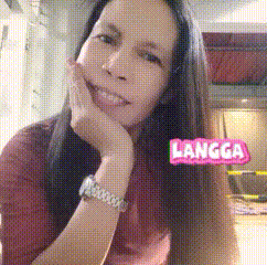 a woman with long black hair is smiling with a sign that says langga
