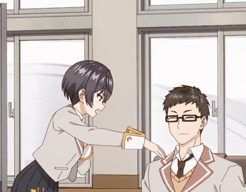 a girl giving a man a piece of paper with a letter a on it