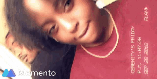a girl in a red shirt with serenity 's friday written on her shirt