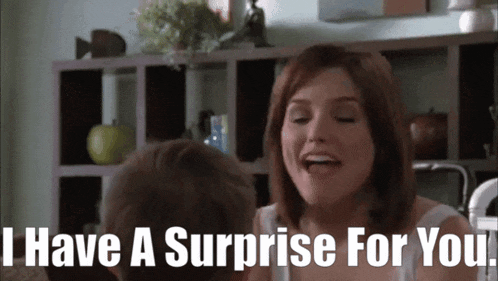 a woman says i have a surprise for you in front of a man