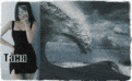 a woman in a black dress is standing next to a whale