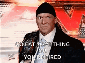a man in a suit and tie is making a funny face and says `` go eat something or you 're fired ''