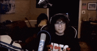 a man wearing headphones and a shirt that says dfg on it